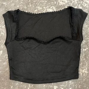 Very soft black ribbed top with lacey detailing. Never worn.